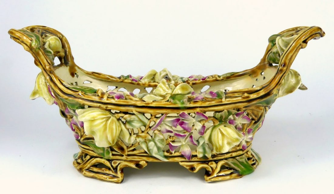 ZSOLNAY PIERCED PORCELAIN FLORAL CENTER BOWL: Zsolnay reticulated porcelain bowl with flowers. Impressed Zsolnay 3819 with additional markings in blue to underside. Measures 14" x 6 1/2" x 6 1/2".