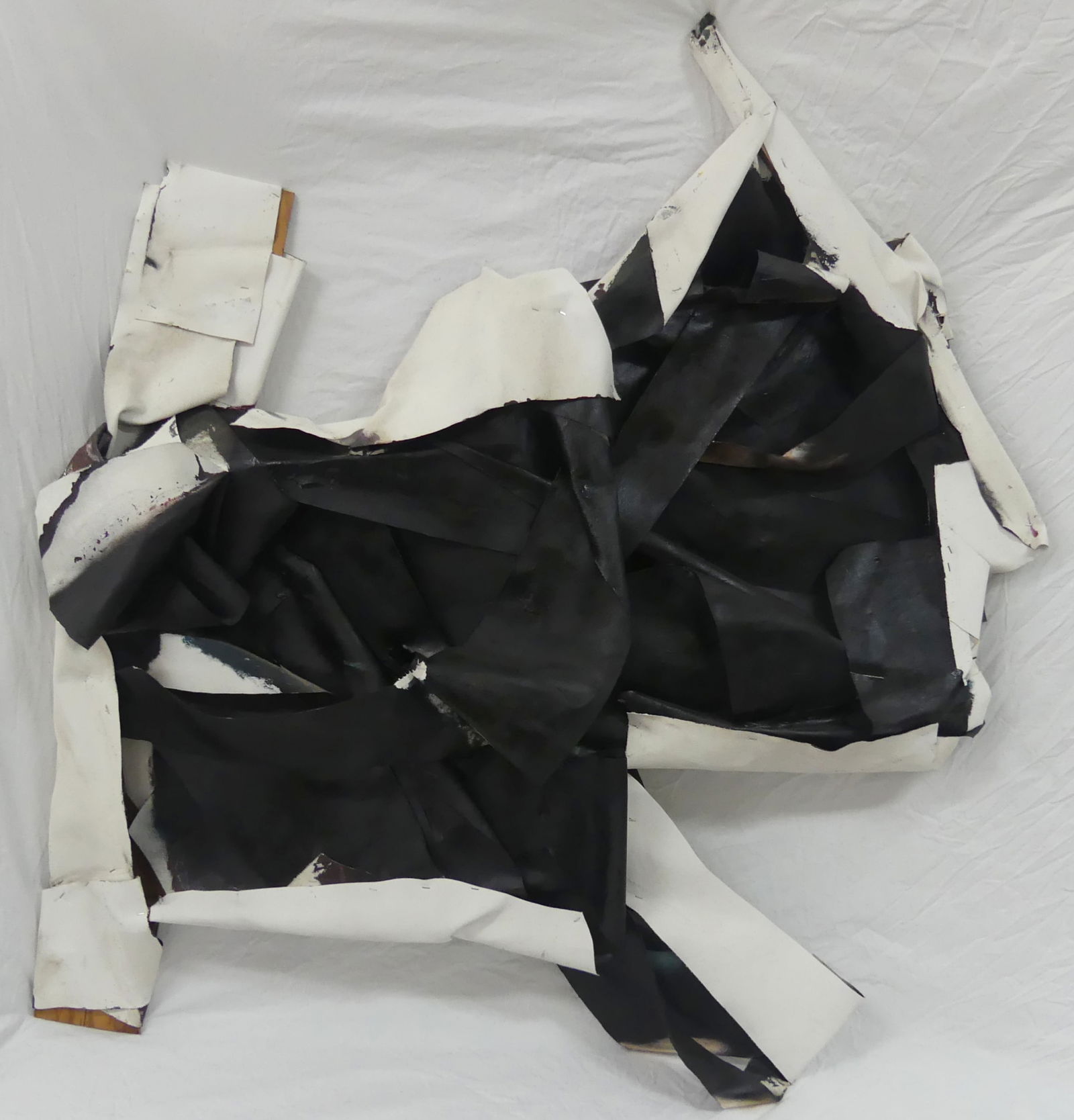 STEVEN PARRINO ACRYLIC ON SHAPED CANVAS 1985: Acrylic painting on canvas, folded and shaped with wood and staples attributed to Steven Parrino (1958 - 2005). Dated January 1985 and stamped to verso. Measures 53 1/4" x 58 1/4" x 9".