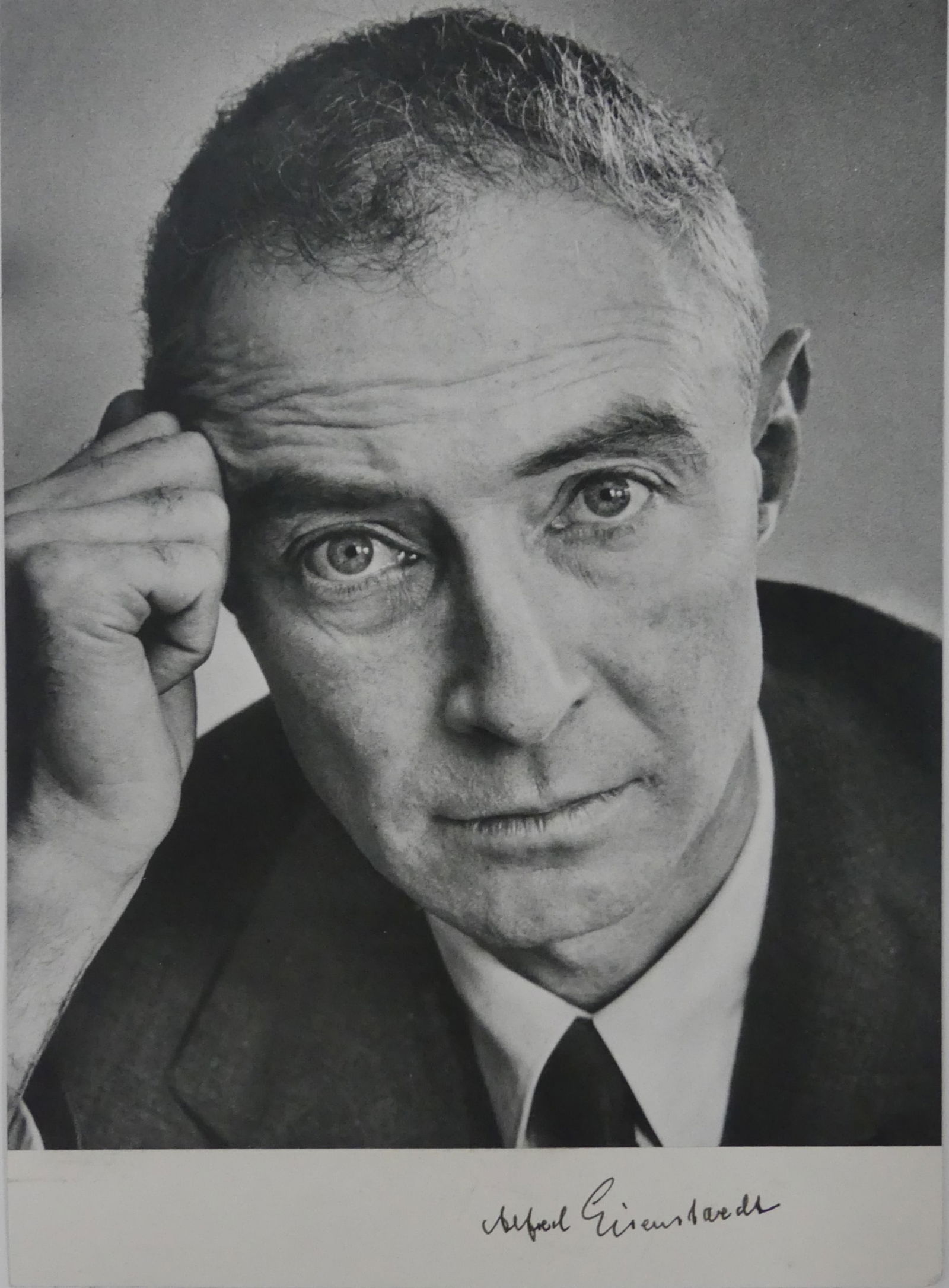 ALFRED EISENSTAEDT 'OPPENHEIMER' SIGNED PRINT: Alfred Eisenstaedt photo print depicting Physicist Dr. J. Robert Oppenheimer. Hand signed lower right. Mounted. Measures 11 1/2" x 8 1/4".