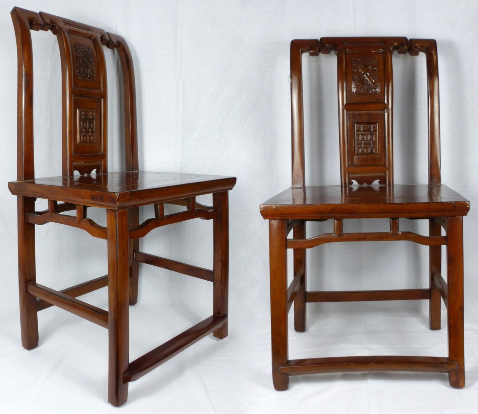 PR CHINESE CARVED HARDWOOD CHAIRS: Pair of Chinese carved wood side chairs. Measures 36 1/2" (92.5cm) height x 19 1/2" (49.5cm) width.