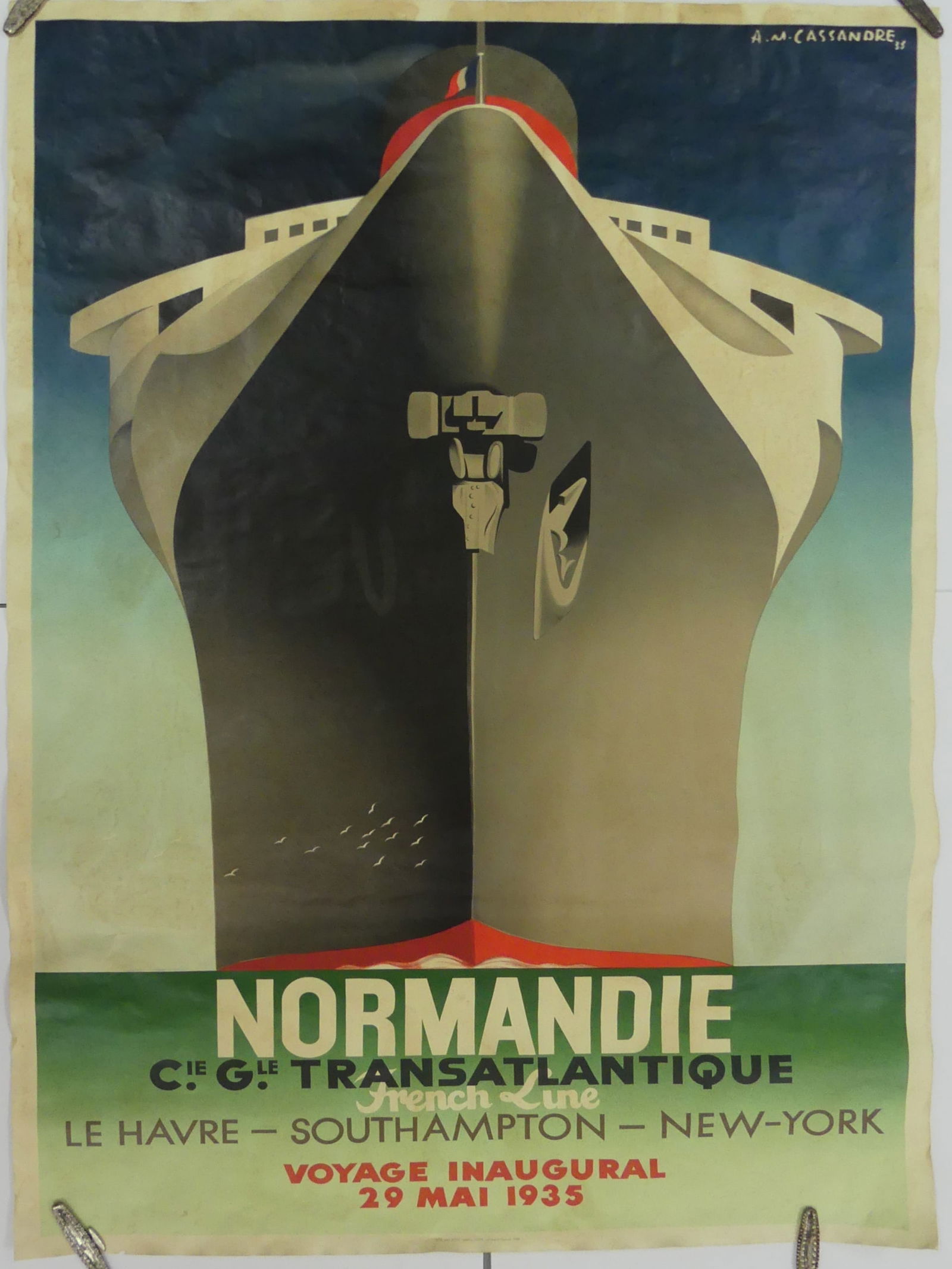 A M CASSANDRA 'NORMANDIE' TRAVEL POSTER: Normandie Cie. Gle Translantique French Line travel poster. Signed in the plate upper right. Sheet measures 62" x 39".