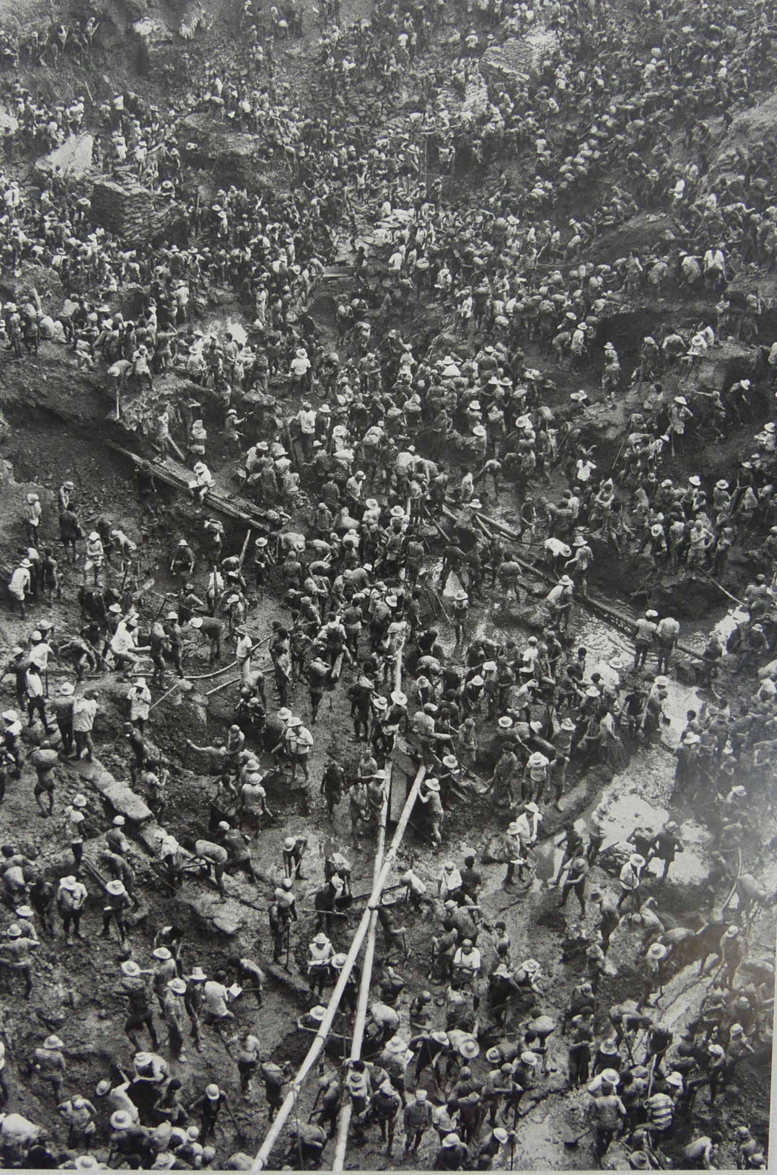SEBASTIAO SALGADO 'GOLD MINE SERRA PELADA': Sebastiao Salgado 'Gold Mine Serra Pelada' photo print. Mounted. Measures 11 5/8" x 7 3/4".