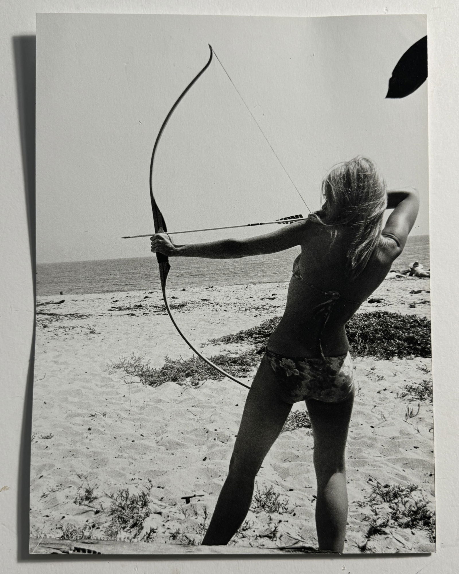 DENNIS HOPPER 'WOMAN SHOOTING ARROW' PRINT: Dennis Hopper (American) 'Woman Shooting Bow and Arrow' print. Mounted. Measures 13 x 9 1/2 inches.