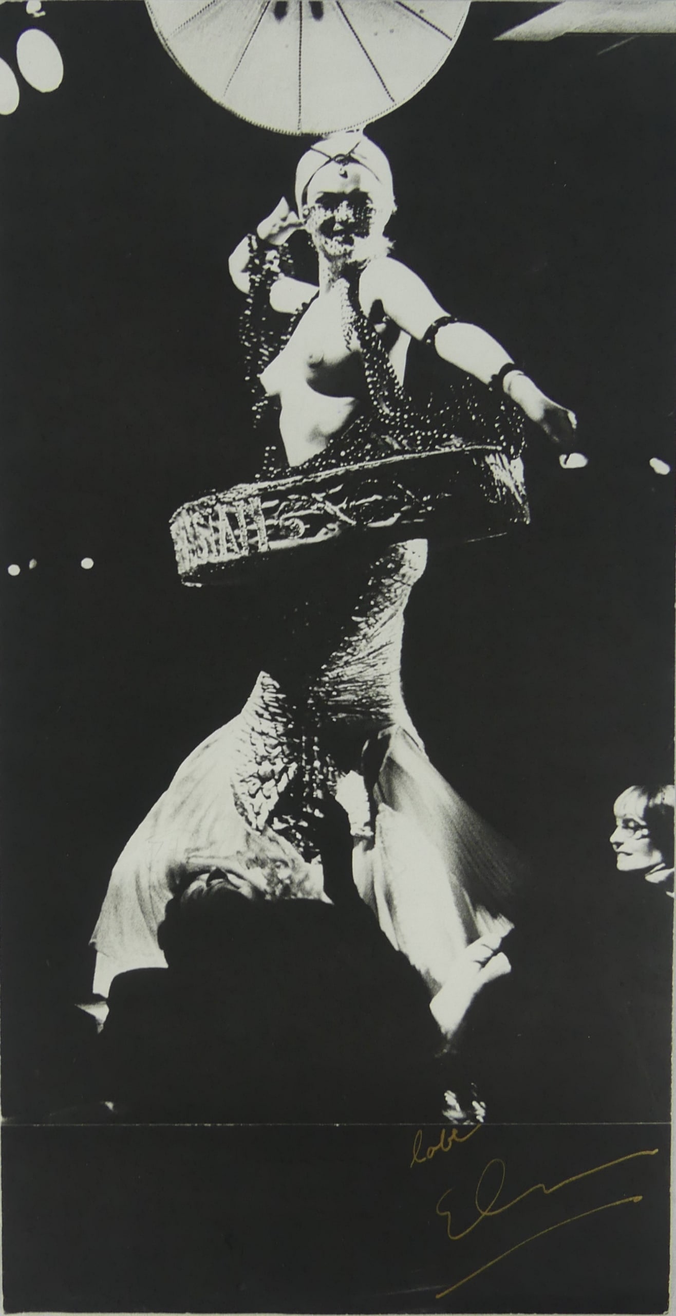 ELLEN VON UNWERTH 'PARIS SHOWGIRL' SIGNED GRAVURE: Ellen Von Unwerth 'Paris Showgirl' gravure. Signed in gold pen lower right. Mounted. Measures 16 1/4" x 8 3/8".