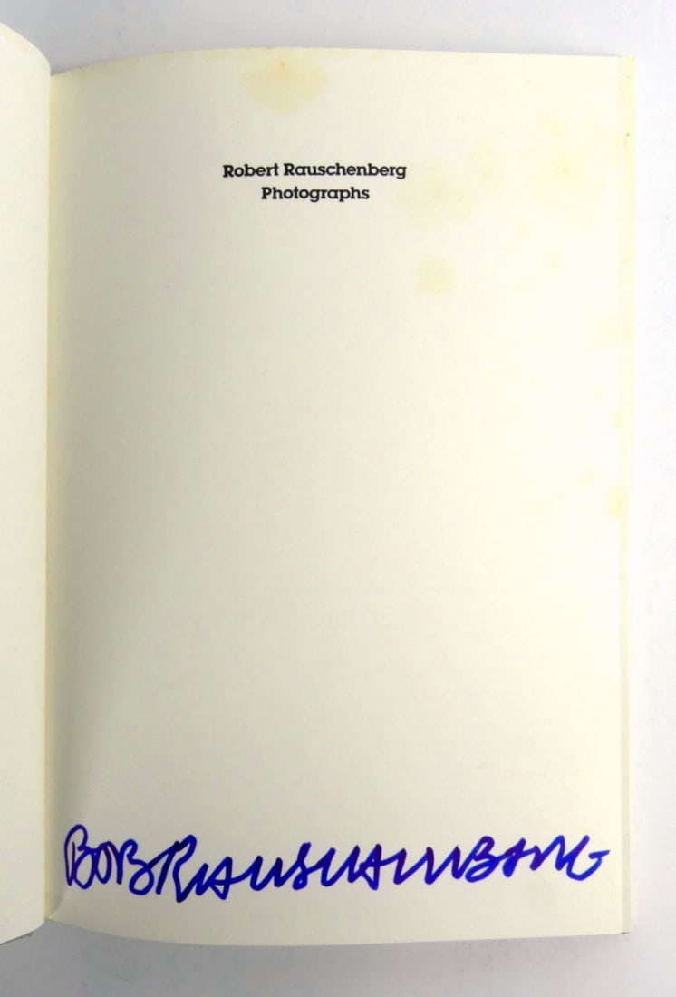 RAUSCHENBERG PHOTOGRAPHS SIGNED BOOK: Robert Rauschenberg 'Photographs' hardcover book. Signed in blue marker to lower edge of second page. Measures 12" x 8 1/2".