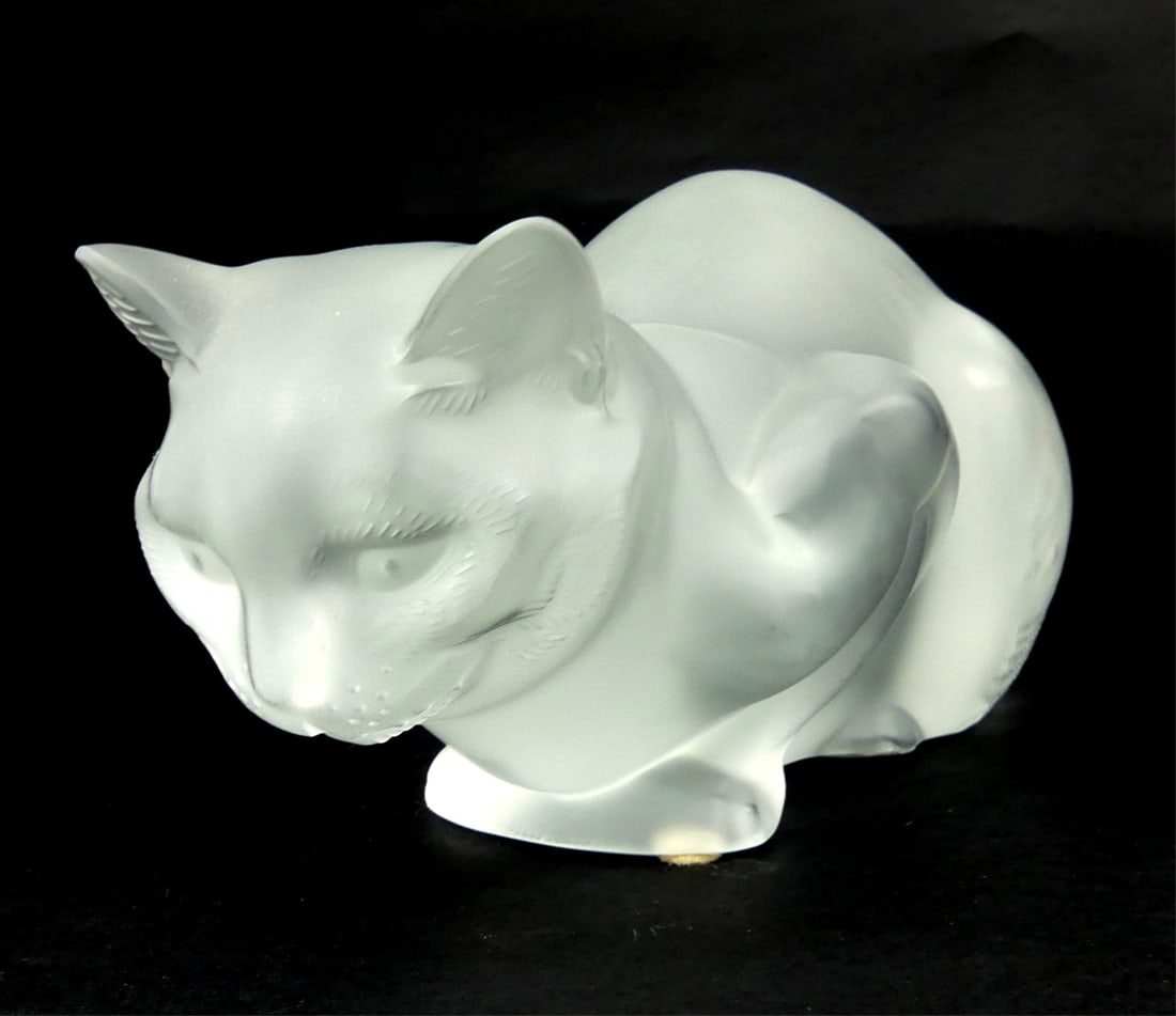 LALIQUE FROSTED CRYSTAL 'CROUCHING CAT' SCULPTURE: Lalique 'Chat Couche' French frosted crystal cat sculpture. Signed to underside and holds label. Measures 9" x 4 1/2" x 4".