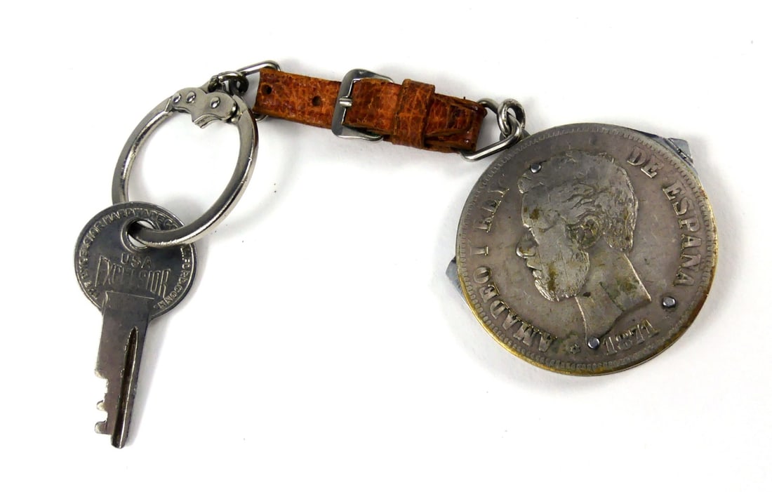 5 PESETA 1875 SILVER COIN 3 BLADE KNIFE KEY HOLDER: 1875 Peseta silver coin. Three blade knife and leather key holder by Eloi Depose. Coin measures 38mm diameter. Overall length 6".