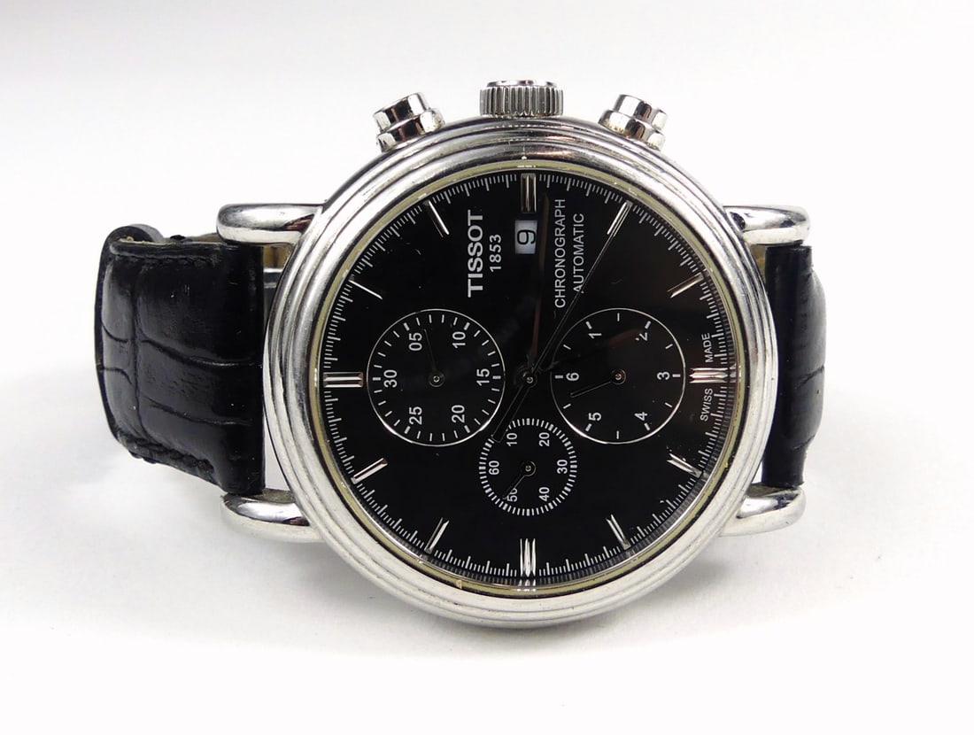 TISSOT CARSON AUTOMATIC 1853 CHRONOGRAPH WATCH: Tissot Carson Automatic 1853 chronograph wrist watch. Stainless steel, detent leather band. 100ft water resistance. 3 registers, sweep second hand and date window. Mechanical movement. Case measures 5