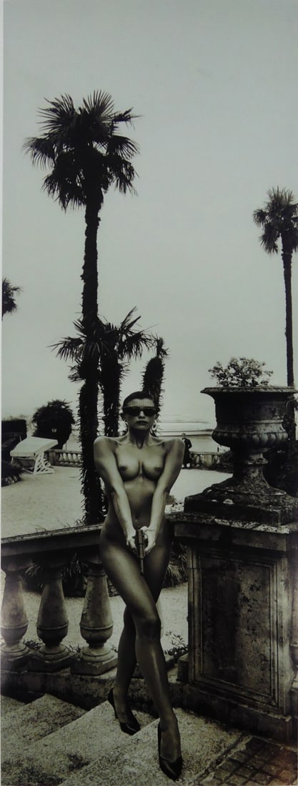 HELMUT NEWTON 'PANORAMIC NUDE, WOMAN w GUN': Helmut Newton 'Panoramic Nude- Woman with Gun-, Grand Hotel Villa Serbelloni, Lake Como 1989' photo print. Sheet measures 31" x 10".