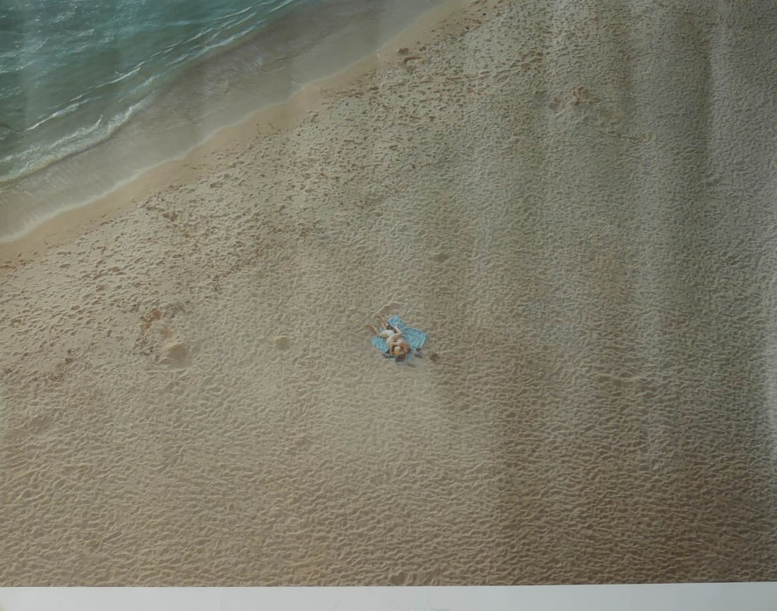RICHARD MISRACH 'ON THE BEACH' SIGNED LITHOGRAPH: Richard Misrach offset lithograph depicting a couple 'On the Beach'. Hand signed in silver paint pen lower center. Sheet measures 43 1/2" x 33 1/4".