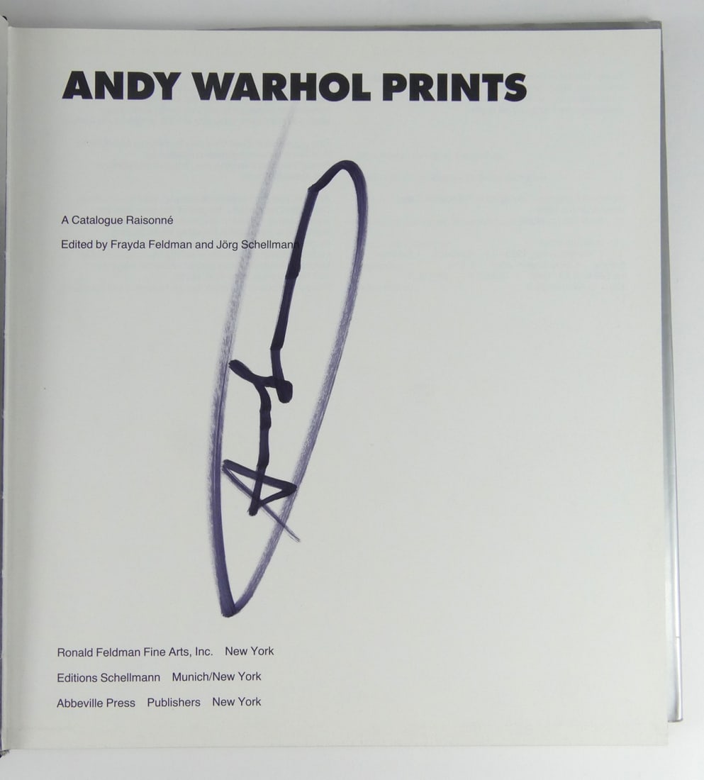 ANDY WARHOL 'PRINTS' SIGNED HARDCOVER BOOK: Andy Warhol 'Prints' Catalogue Raisonne hardcover book depicting Venus to dust cover. Signed by Andy Warhol in black marker to title page. Measures 10 1/2" x 9 3/4".