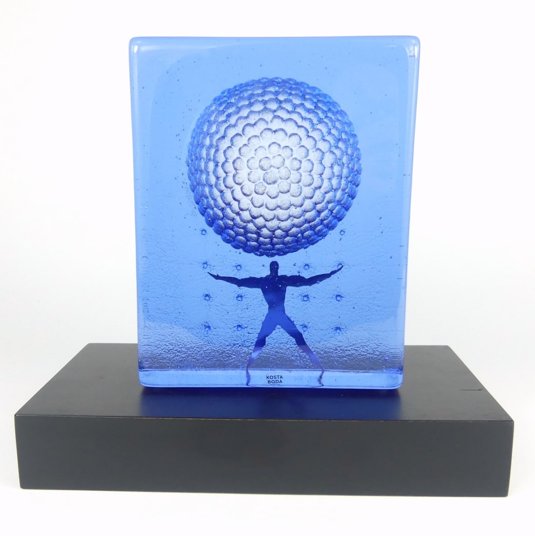 BERTIL VALLIEN 'ICON SPIRIT' GLASS BLOCK SCULPTURE: Bertil Vallien for Kosta Boda 'Icon Spirit' art glass sculpture. Signed to underside. Holds original labels. Includes 10" wooden base. Glass sculpture measures 7 1/2" x 5 3/4" x 2".