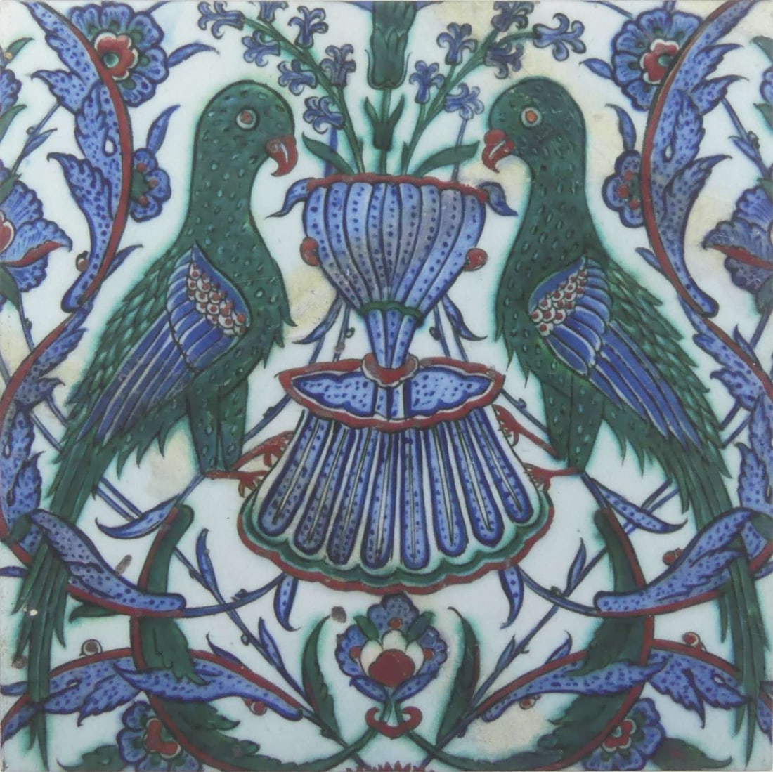 IZNIK OTTOMAN STYLE CERAMIC POTTERY BIRD TILE: Iznik Ottoman style ceramic tile depicting birds and stylized foliage. Measures 11 5/8" x 11 5/8".