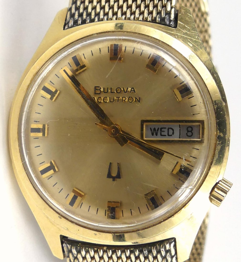 BULOVA ACCUTRON 1973 WRISTWATCH: Bulove Accutron gold filled wrist watch with Accutron gold filled band. Case measures 34mm width and 39mm lug to lug.
