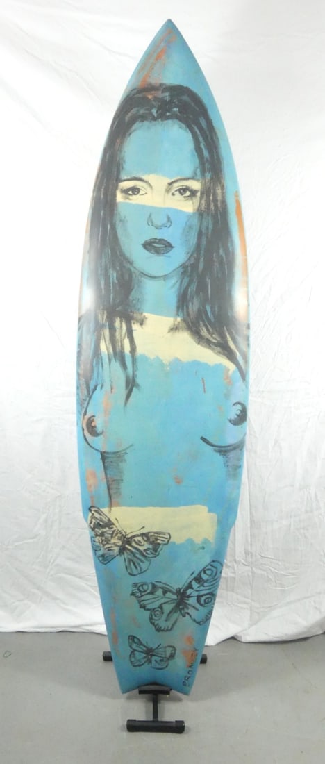 DAVID BROMLEY PAINTED SURFBOARD: David Bromley (English, b. 1960) painted fiberglass surfboard. Depicts a nude female figure with butterflies. Signed lower right. Painted yellow flowers to underside. Signed lower left. Surfboard meas