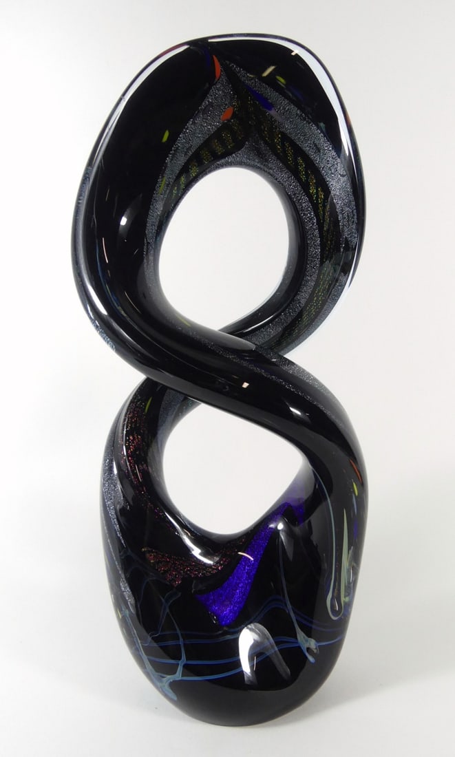 ROLLIN KARG DICHROIC GLASS SCULPTURE: Rollin Karg Dichroic studio art glass sculpture in the form of a figure eight. Signed and dated 2005 to edge of base. Measures 16" x 7" x 5".