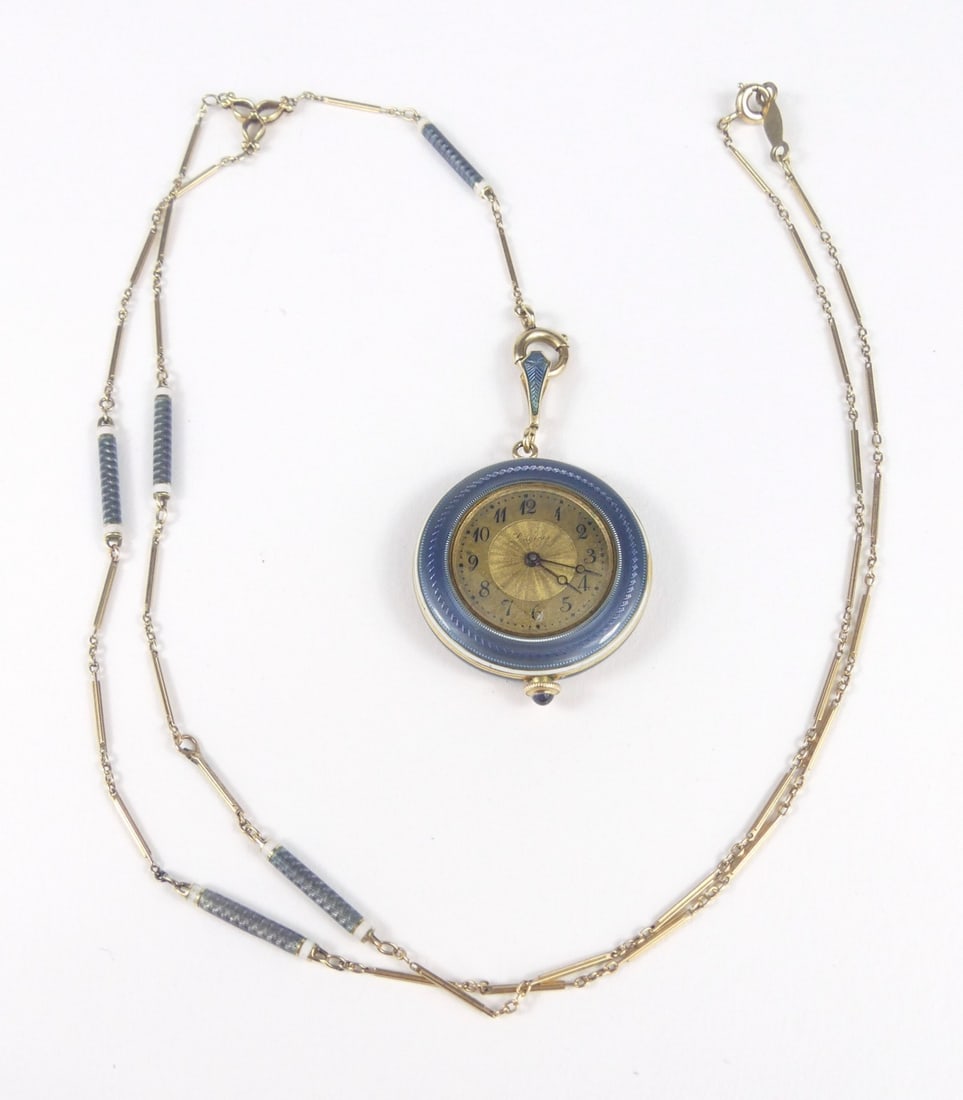 ANTIQUE 14kt YG GUILLOCHE ENAMEL PENDANT WATCH: Antique 1914 ladies 14kt yellow gold blue-grey guilloche enameled pendant watch. Includes 25" 10K chain with matching enamel.15j. Case measures 26mm diameter. Total weight 23.6g.
