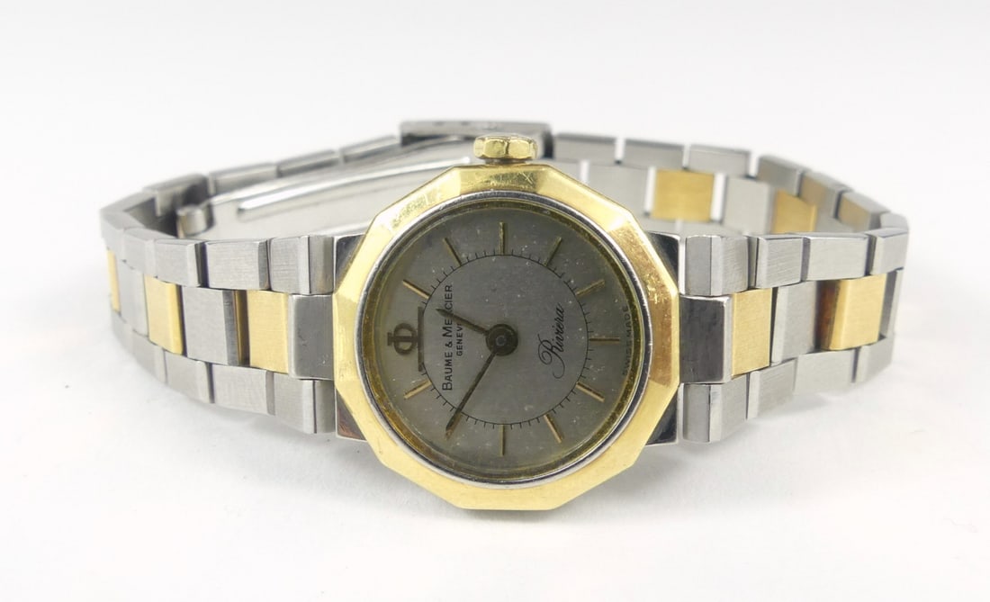 BAUME & MERCIER 'RIVIERA' LADIES WRISTWATCH: Ladies Quartz Baume & Mercier Geneve Rivera wristwatch. Stainless steel with gold accents. Original band and crown. Case measures 20mm width.