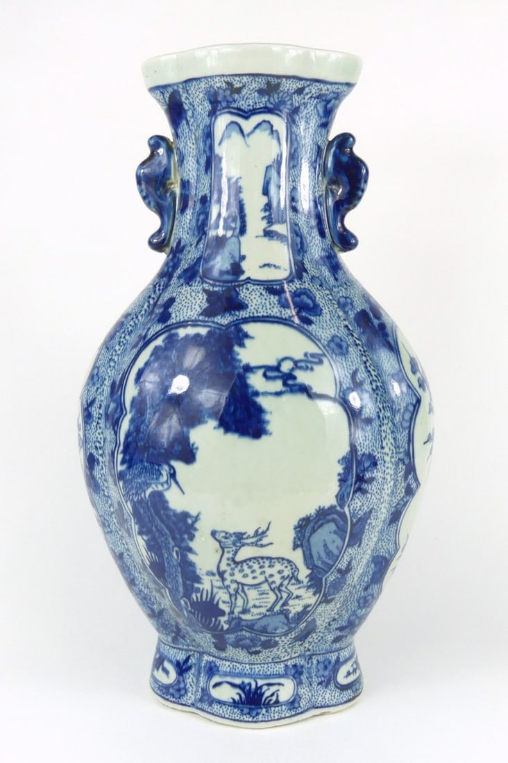 CHINESE BLUE & WHITE PORCELAIN HANDLED DEER VASE: Chinese blue and white porcelain vase with twin handles. Depicts a deer with bird and pine trees. Marked to underside. Measures 15" x 8" x 5 1/2".