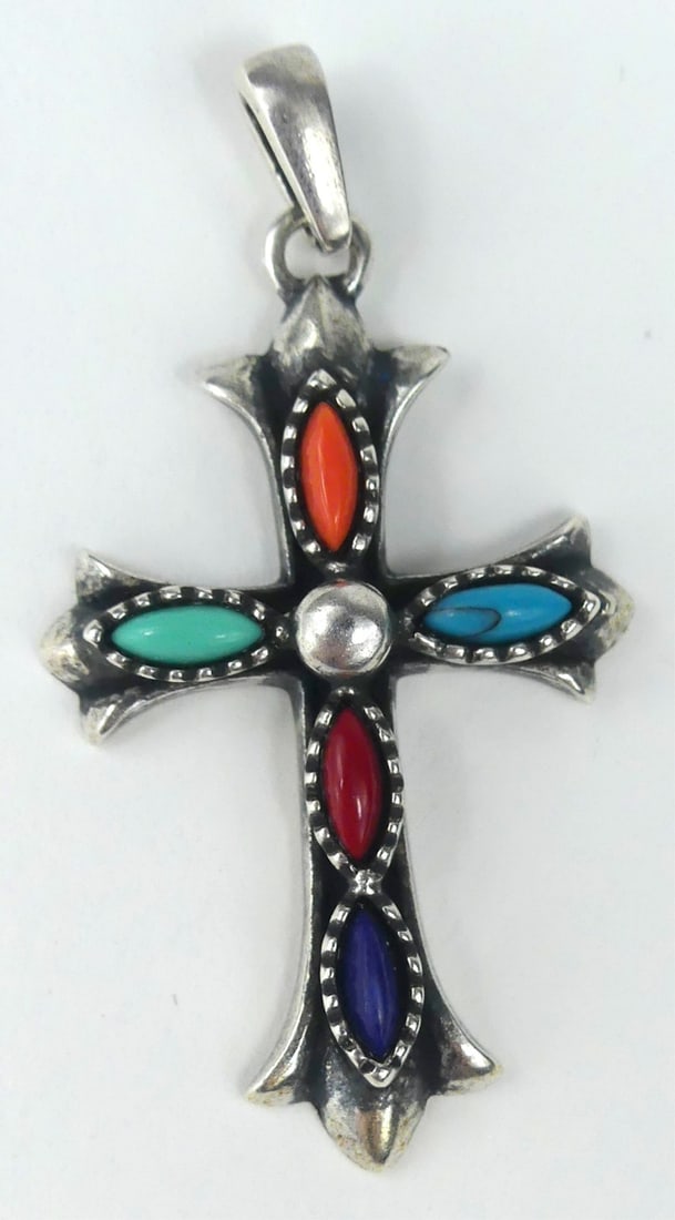ELVIS PRESLEY OWNED STERLING SILVER CROSS PENDANT: Elvis Presley owned sterling silver, turquoise and coral pendant in the form of a cross. Marked AHM 925 to verso. Measures 1 1/2" x 3/4". Includes documentation hand signed by Vernon Presley.