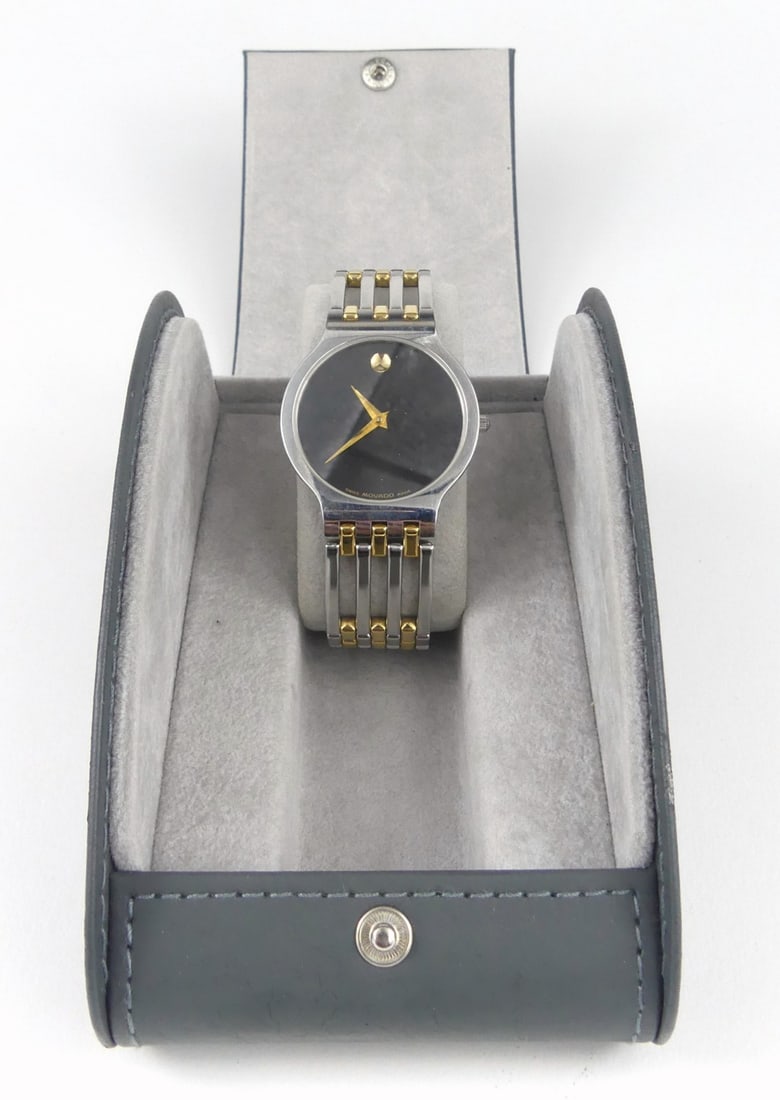 MOVADO 'ESPERANZA' MUSEUM WRISTWATCH w BOX: Movado 'Esperanza' museum wrist watch. Gold tone and stainless steel with black dial. Unisex, sapphire crystal. Includes box and papers. Case measures 33mm width x 38mm lug to lug. Box measures 5 1/2"