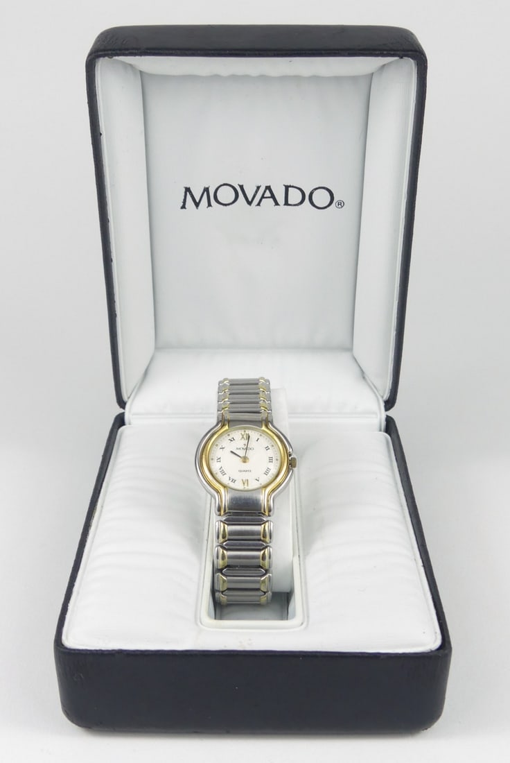 MOVADO LADIES QUARTZ MUSEUM WRISTWATCH w BOX: Movado Ladies Quartz Museum wrist watch. Gold tone and stainless steel. Includes original box. Case measures 26mm width. Box measures 4 1/2" x 3 1/2" x 2".