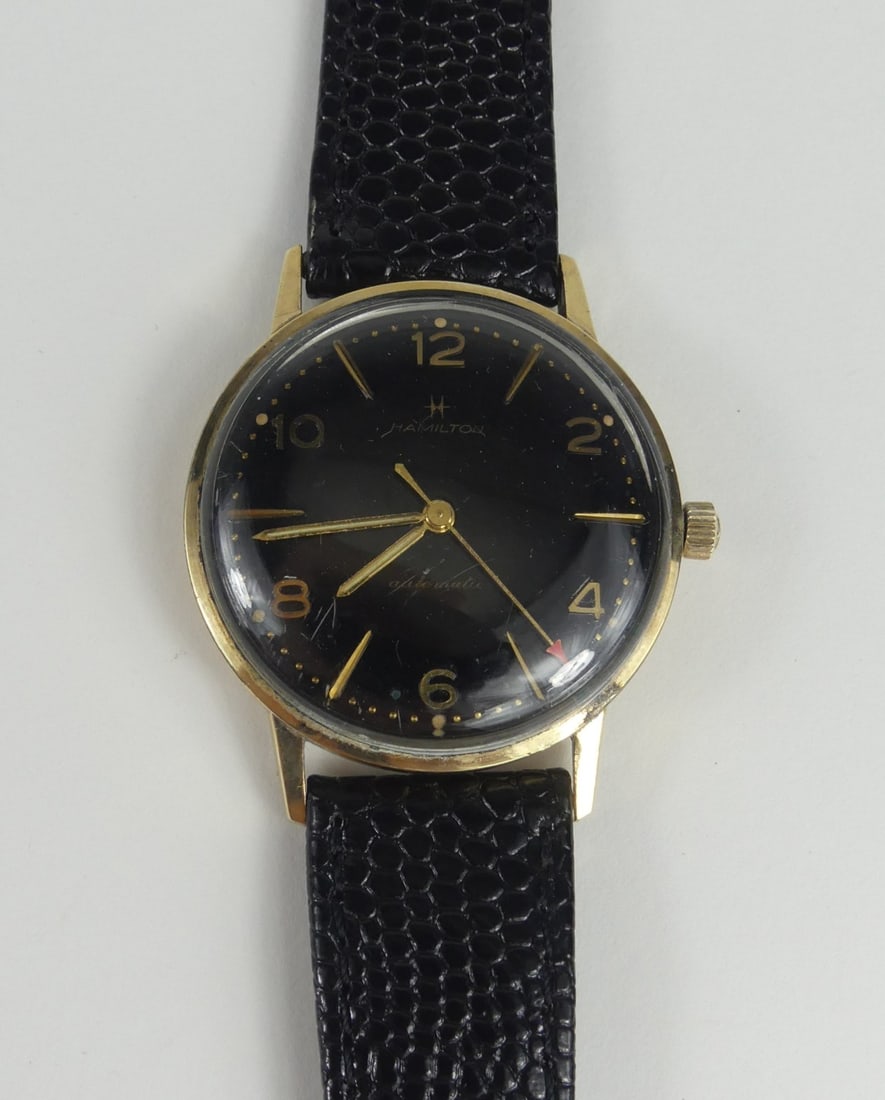 HAMILTON MEN'S AUTOMATIC WRISTWATCH: Hamilton men's automatic gold filled wrist watch. Red arrow second hand and original crown. New leather band. Circa 1950's. Case measures 33mm width and 38mm lug to lug.