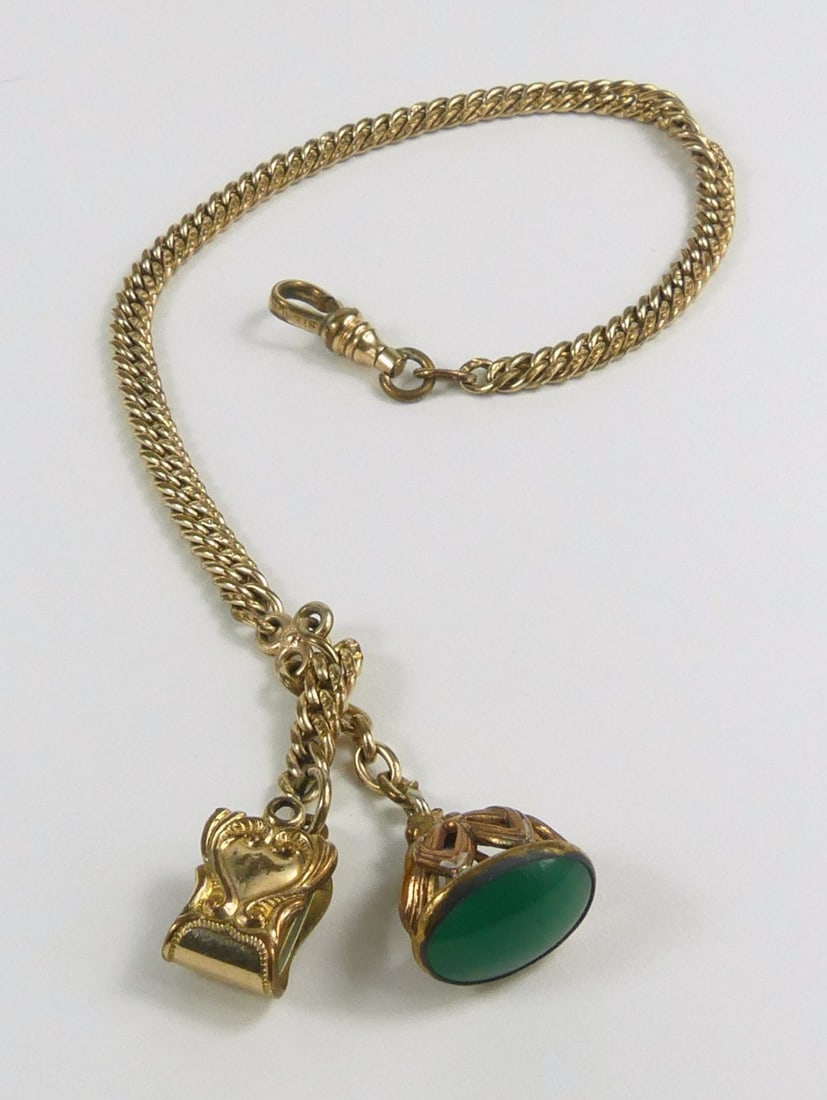 GOLD FILLED POCKET WATCH CHAIN w FOB & CLIP: Gold filled pocket watch chain with attached fob and clip. Measures 12" length.
