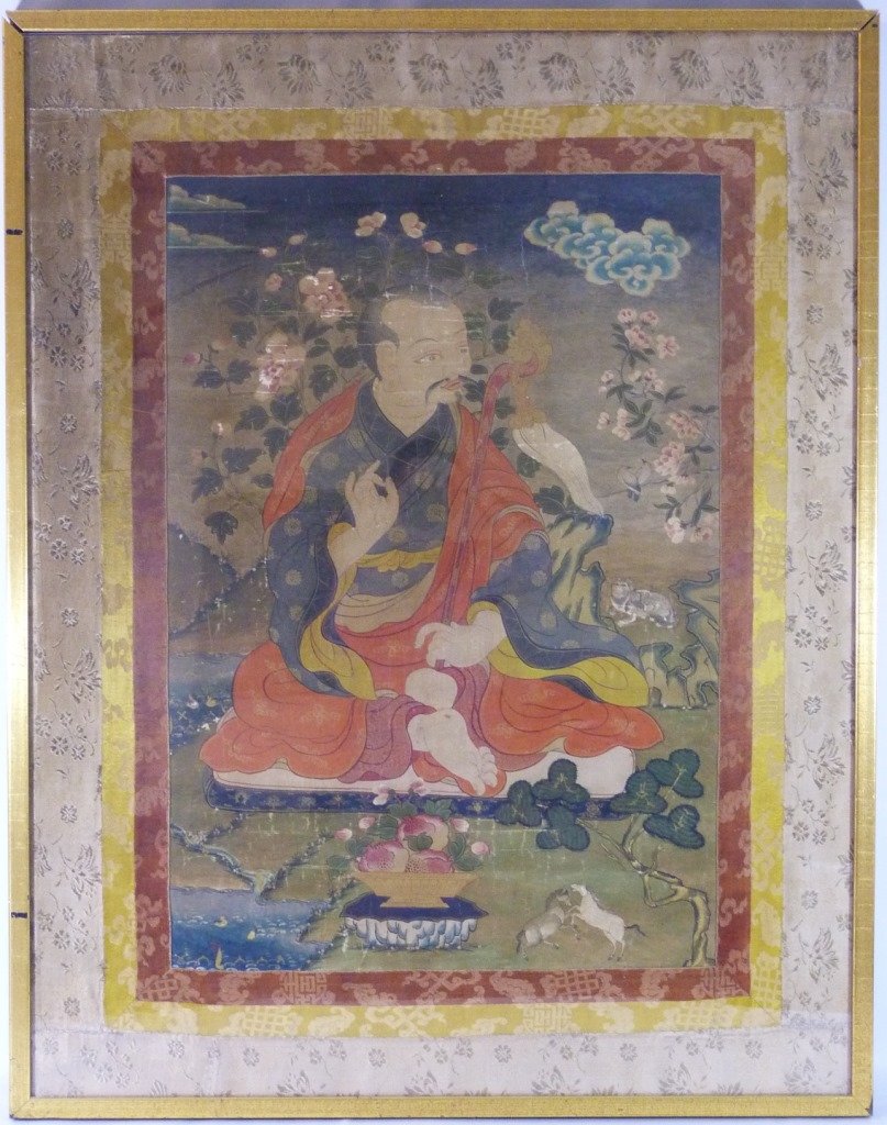TIBETAN HAND PAINTED THANKA ON SILK/COTTON: Tibetan hand painted Thangka on silk or cotton depicting a Buddhist deity, scene, or mandala. Purchased from the collector in the 80's from a gallery. Measures in frame 39" (99cm) height by 31" (79cm)