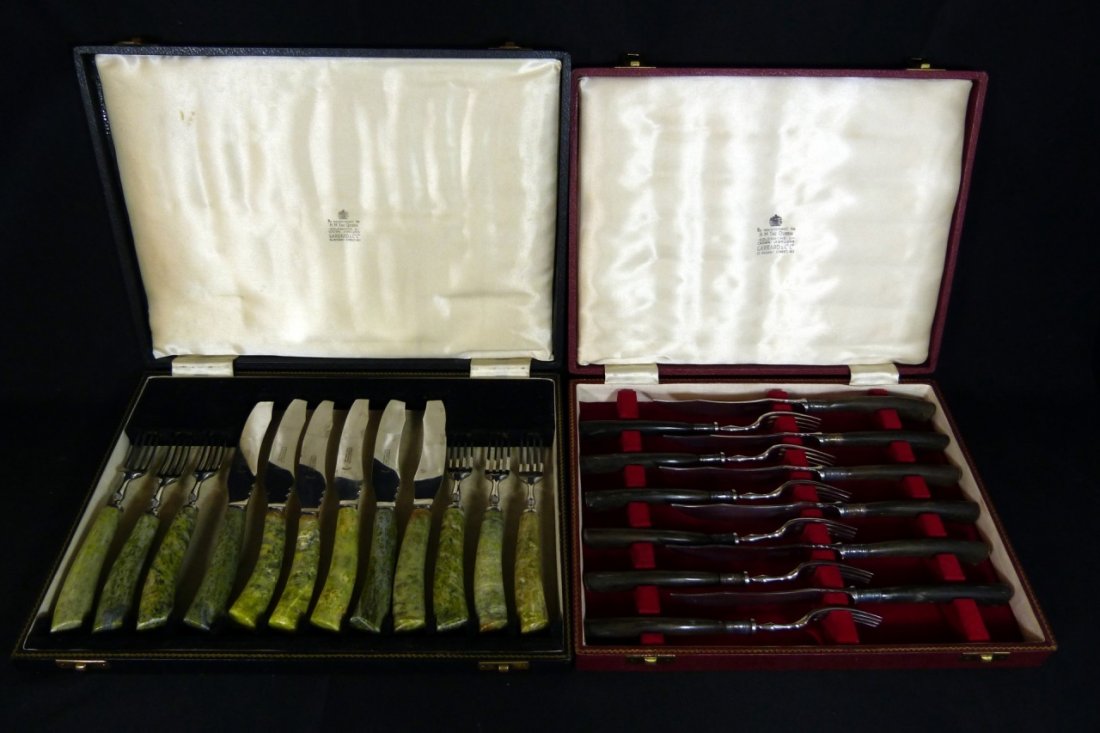 2 SETS GARRARD & CO ENGLISH FORKS & KNIVES 24pc: Two complete sets of Garrard & Co forks and knives. Each set features six forks and six knives has its own fitted box. One set ebonized wood and the other is a green hardstone. Each box is marked "By 