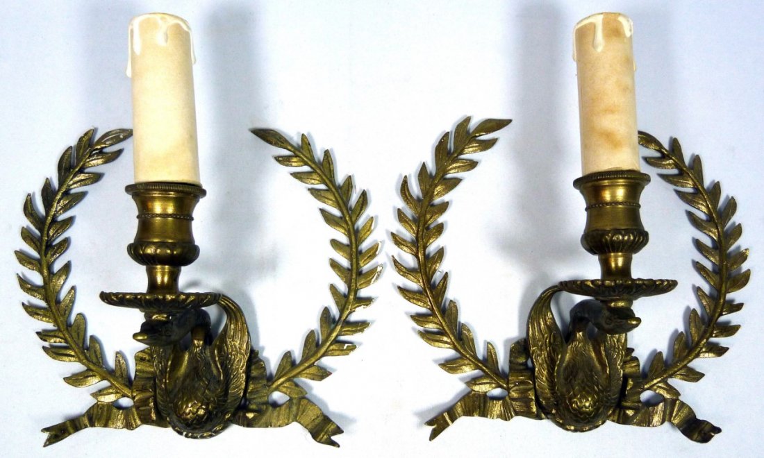VINTAGE BRASS ORNATE DECORATIVE SCONCES: Vintage brass ornate decorative sconces depicting a goose or swan acting as the base surrounded by garlands. Each measures approx 8" (20cm) height and width.