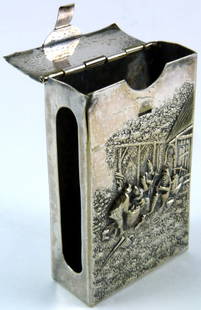 LARGE DANISH ANTIQUE SILVER REPOUSSE MATCH CASE: Large Danish antique silver repousse matchbox holder depicting a village scene in high relief. Measures 3 1/2" (9cm) height by 2 1/4" (5cm) width, total weight 72g (2.3ozt).