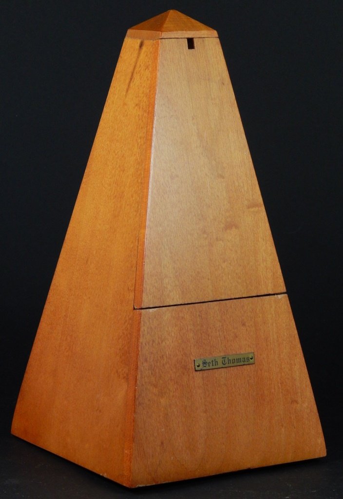 SETH THOMAS WOOD & BRASS METRONOME: Seth Thomas wood with brass accents metronome. Measures 9" (23cm) height, total weight 468g.