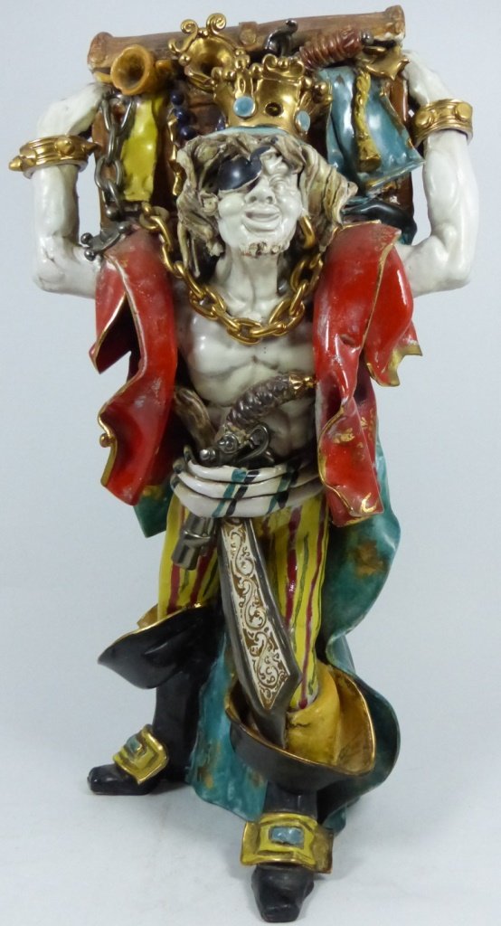ITALIAN PORCELAIN PIRATE SCULPTURE A. CARTEI: Italian porcelain sculpture depicting a crowned pirate holding a treasure chest above his shoulders. Signed A.Cartei to bottom and marked 1200/10 Italy. Measures 17 1/2" (44cm) height.