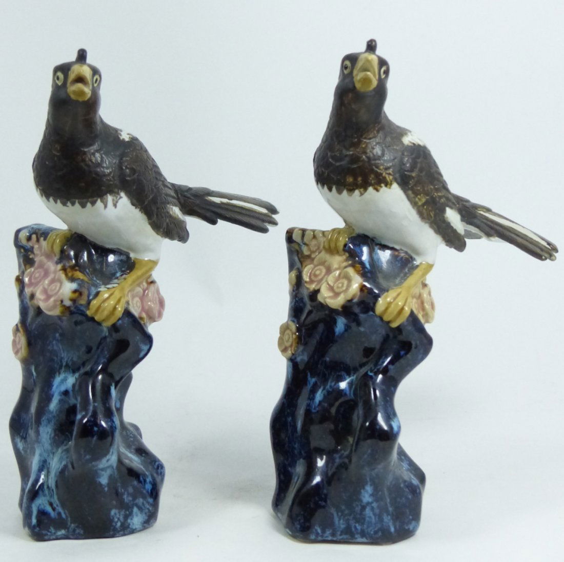 PAIR CHINESE GLAZED PAINTED PORCELAIN BIRDS: Pair of Chinese hand painted glazed porcelain birds. Circa mid 20th century. Measures 8" (20cm) height.