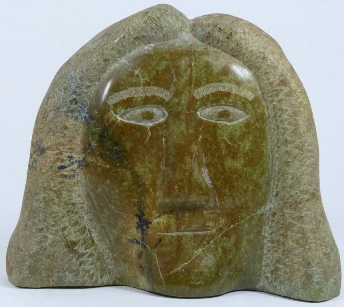 SHORTY INUIT CARVED SCULPTURE OF FACE: Hardstone carving by Canadian Eskimo artist Shorty, from Lake Harbour, depicting a face. Measures 10 1/2" (26cm) length x 9" (23cm) height.