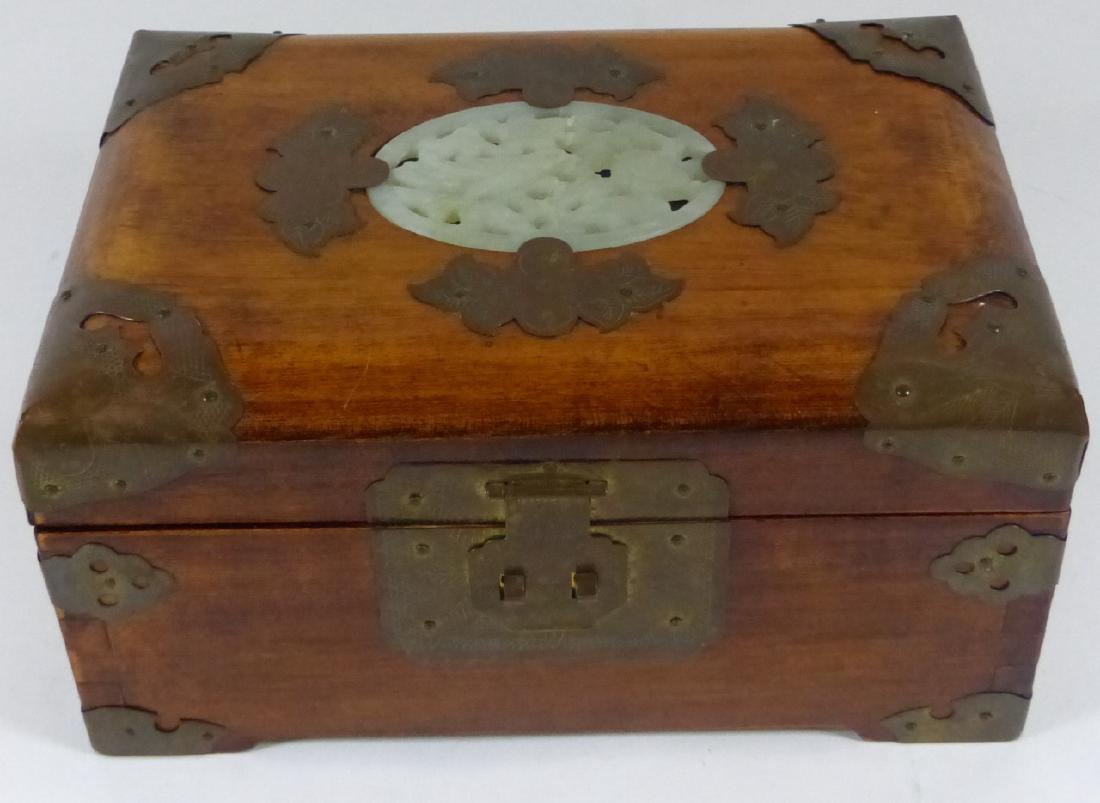 CHINESE WOOD JEWELRY BOX w JADE PLAQUE: Chinese wooden jewelry box with brass hardware and carved jade plaque to top. Measures 8" (20cm) length x 5" (12.5cm) depth.