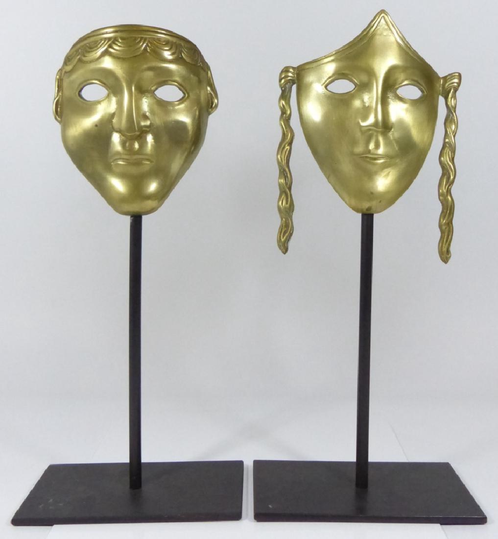 PAIR ROMANESQUE BRASS MASKS ON METAL STANDS (1 of 6)