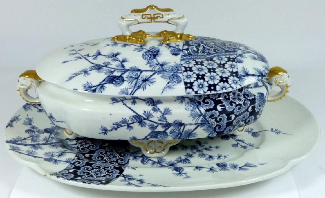 ROYAL WORCESTER LIDDED TUREEN w UNDERPLATE: Royal Worcester lidded tureen with underplate. Blue and white pine tree and floral design with gold gilt accents. Applied elephant head handles to tureen and bird-form handle to lid. All three pieces 