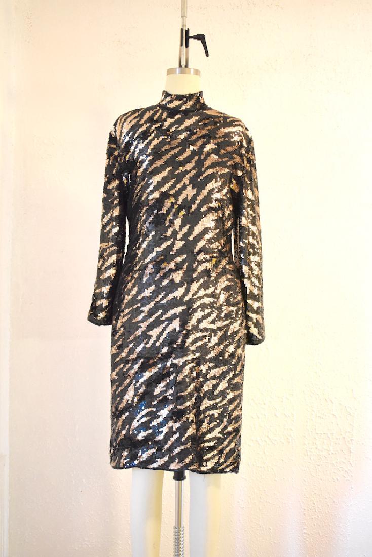 Vintage 1980s Tiger Stripe Black Gold Sequin Dress: This item above is a "Vintage 1980s Tiger Stripe "Sequin Dress. This dress is in excellent condition with minor wear. Zipper in the back for closure .Beautiful gold and black sequin designs throughout