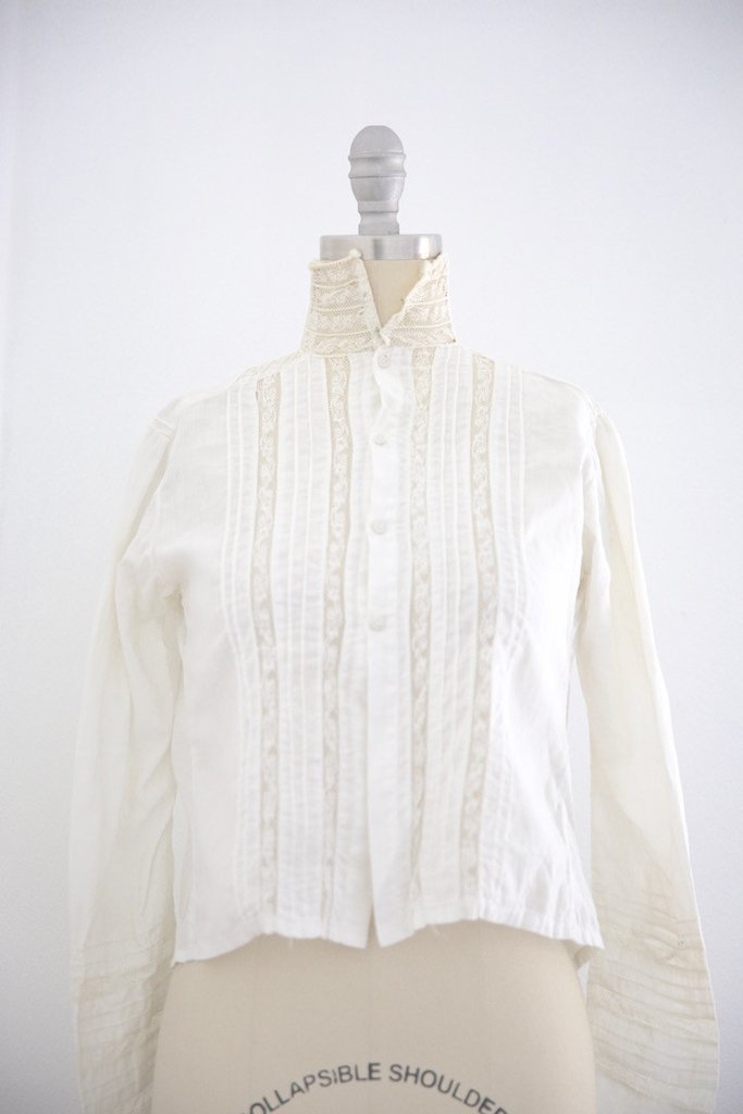 Edwardian Lace Cotton Blouse High Collar: This item above is a Edwardian Lace Cotton Blouse High Neckline . Great condition for it's age. Minor wear and tear. 4 "buttons on the front of the blouse. Lace detailing throughout the bodice and sle