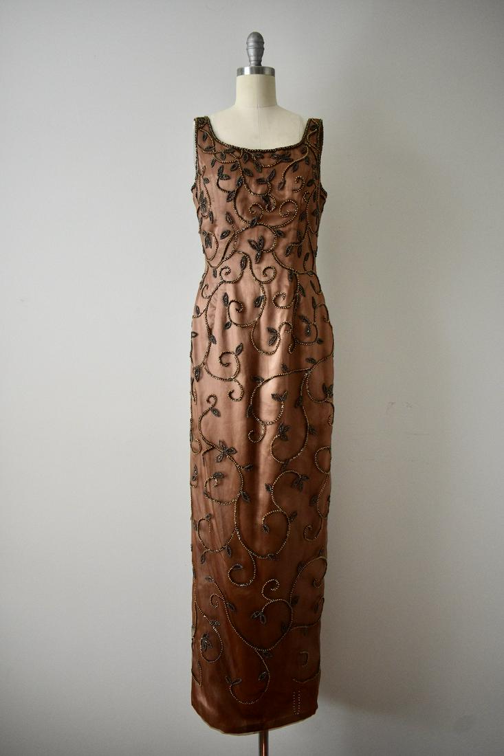 Vintage Inspired Modern Brown Beaded Gown: This item above is a Vintage Inspired Modern Brown Beaded Gown. Very good condition with minor wear and tear. Some lose beading at the bottom of the gown. Zipper in the back for closure. Beads around