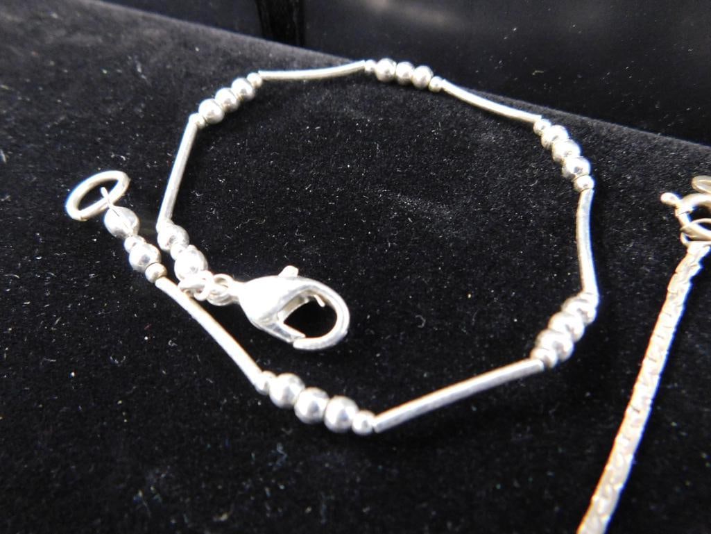Sterling Silver - 9 Bracelets - 26.78 Grams TW - 5