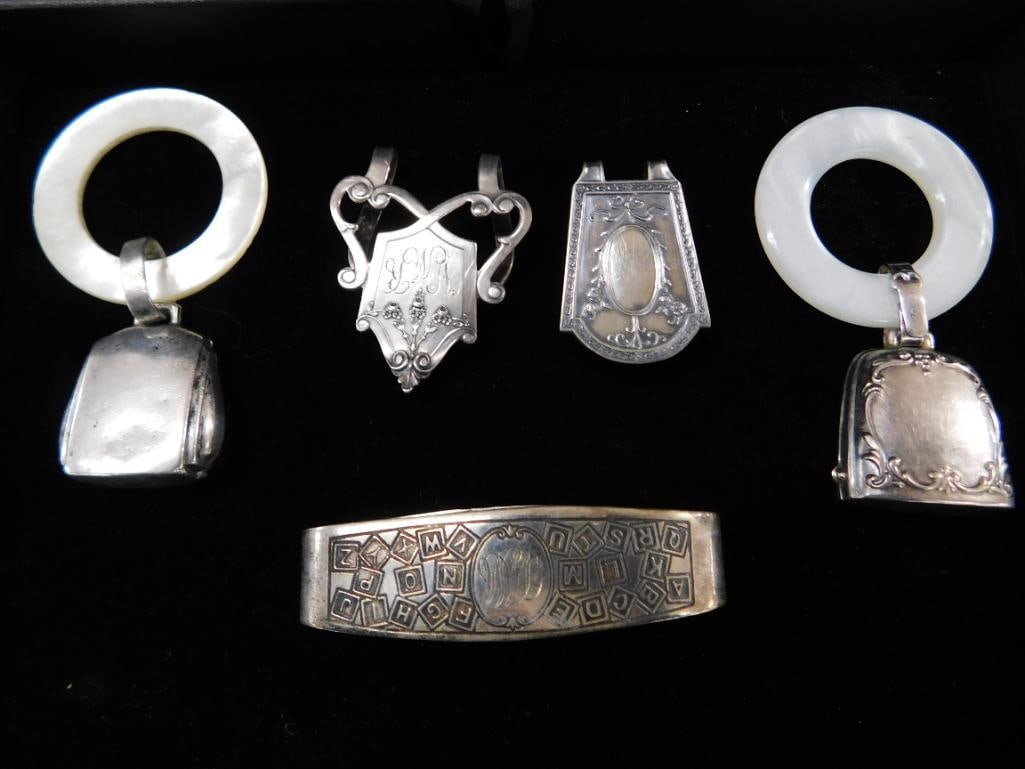 Sterling Silver - 2 Book Markers and Napkin Ring 36 Grams - 2 Webster Rattles 31 Grams TW - 10