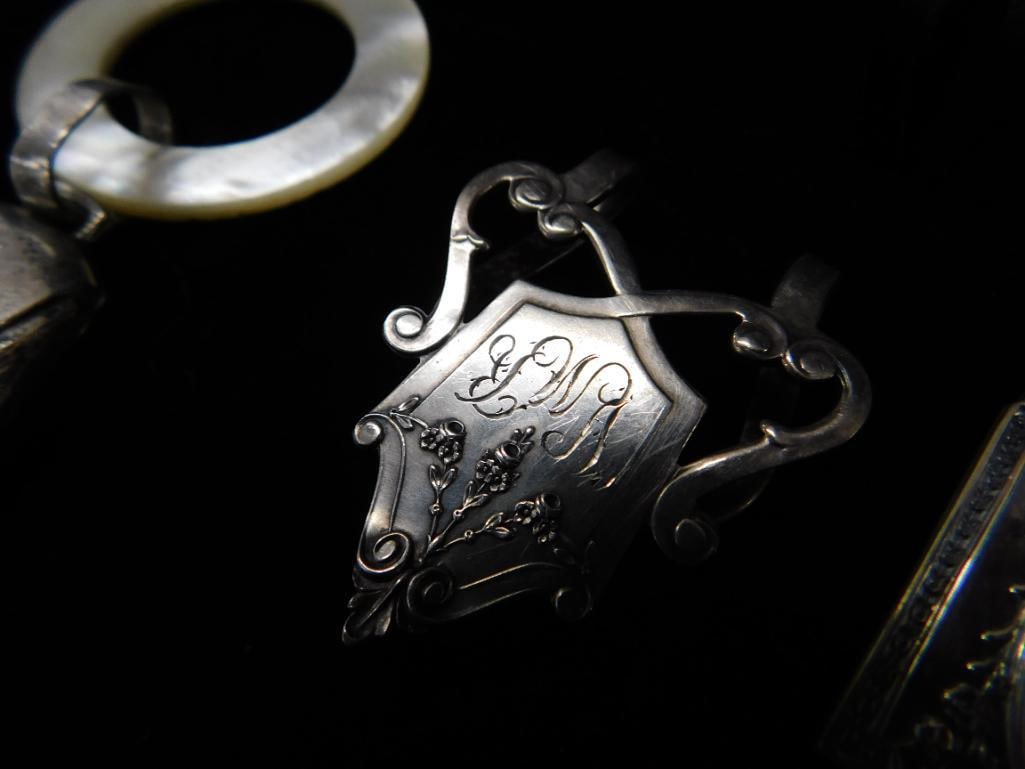 Sterling Silver - 2 Book Markers and Napkin Ring 36 Grams - 2 Webster Rattles 31 Grams TW - 4