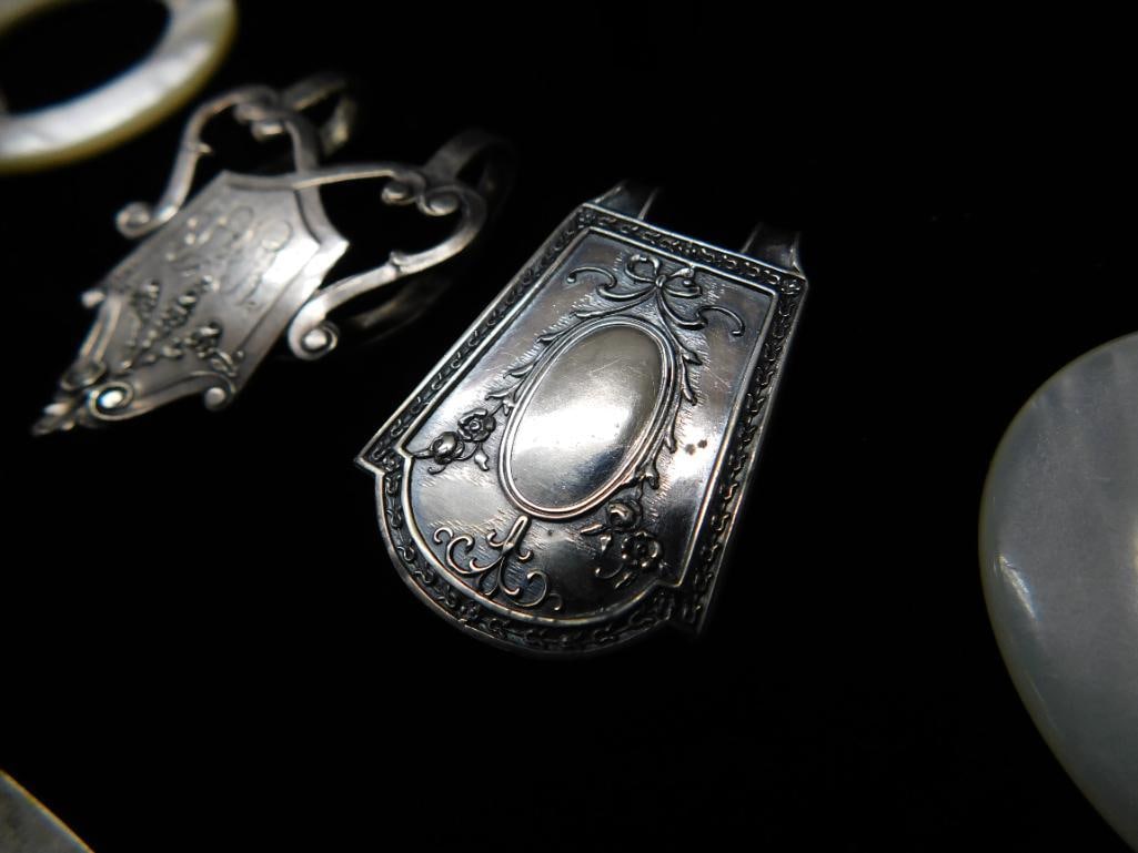 Sterling Silver - 2 Book Markers and Napkin Ring 36 Grams - 2 Webster Rattles 31 Grams TW - 5