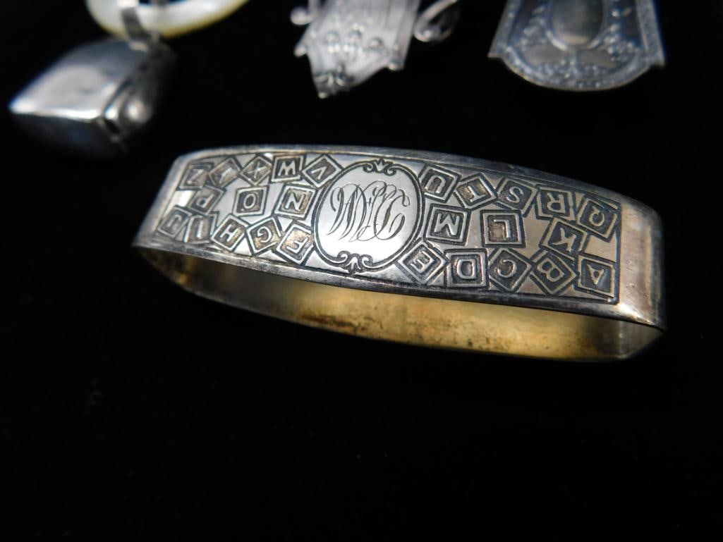 Sterling Silver - 2 Book Markers and Napkin Ring 36 Grams - 2 Webster Rattles 31 Grams TW - 6