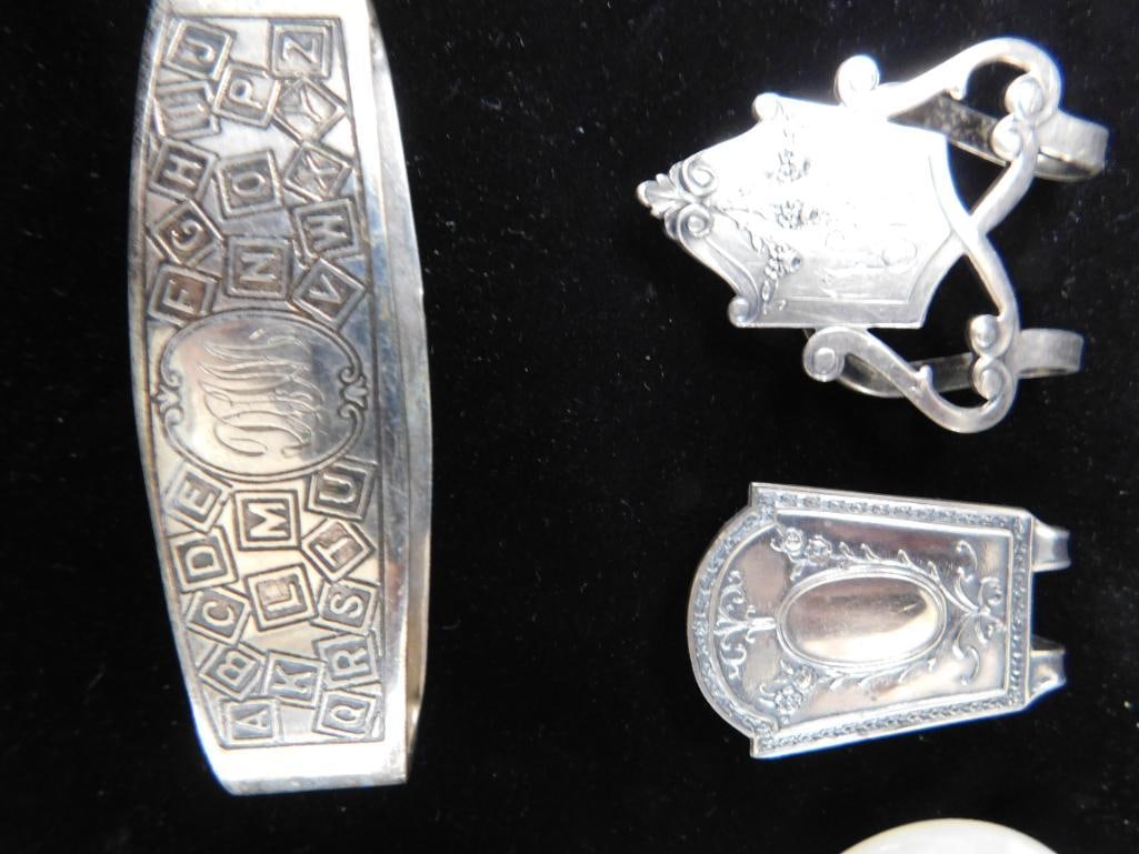 Sterling Silver - 2 Book Markers and Napkin Ring 36 Grams - 2 Webster Rattles 31 Grams TW - 7
