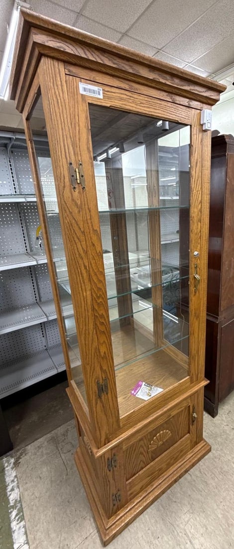 lighted curio/display cabinet with glass shelves: Three sides glass, back side mirror, door on the bottom. 73" x 27" x 18"