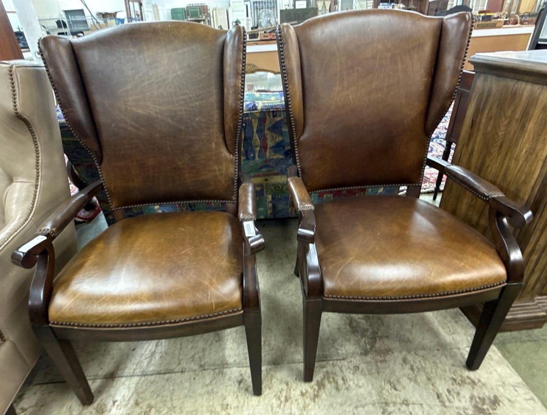 pair of brown leather arm chairs: Each 45" x 26" x 28"